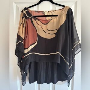 🟢TINY. Sheer abstract flower overlay a tank. Size large.